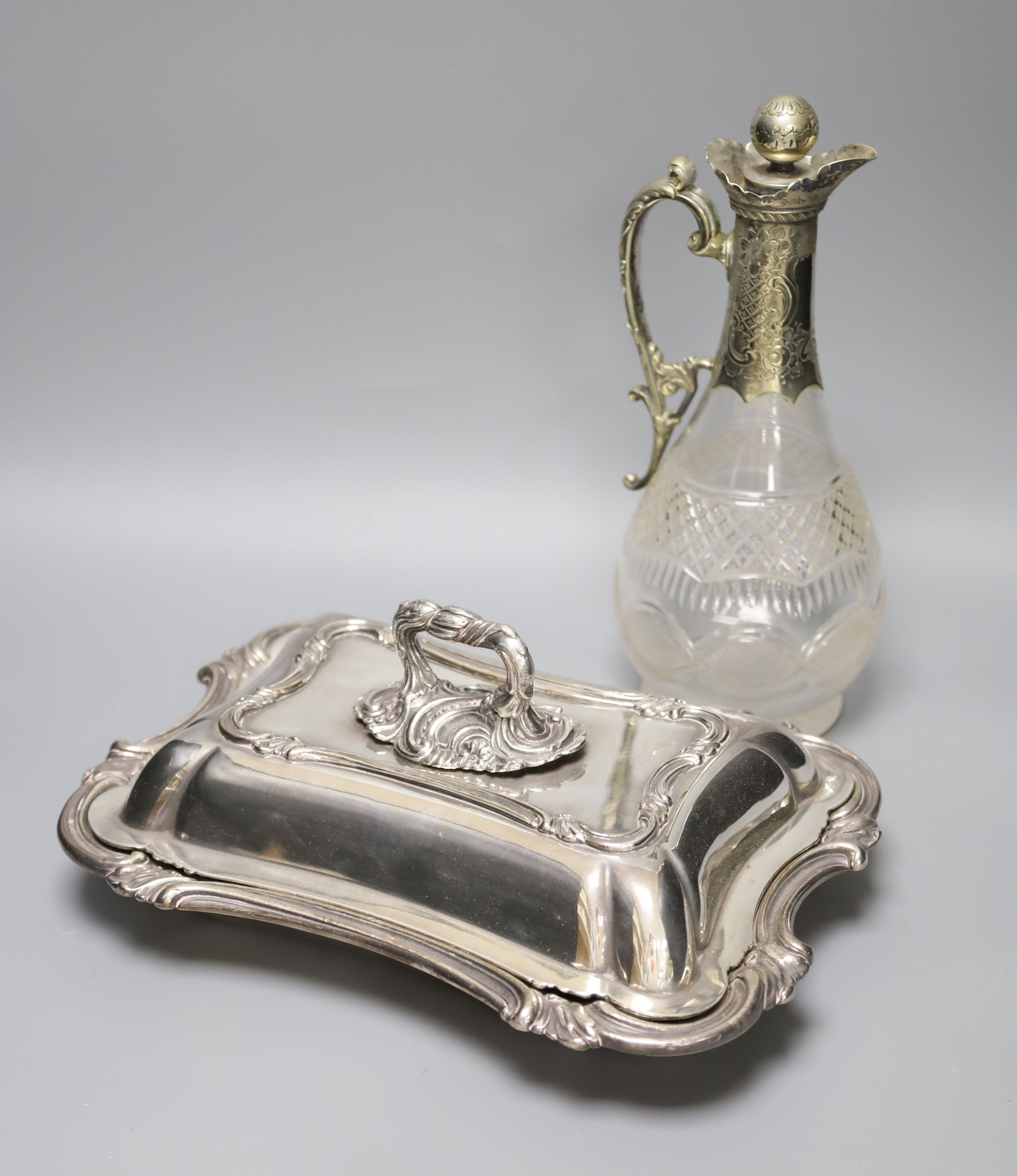 A Victorian plated tureen and cover and a claret jug